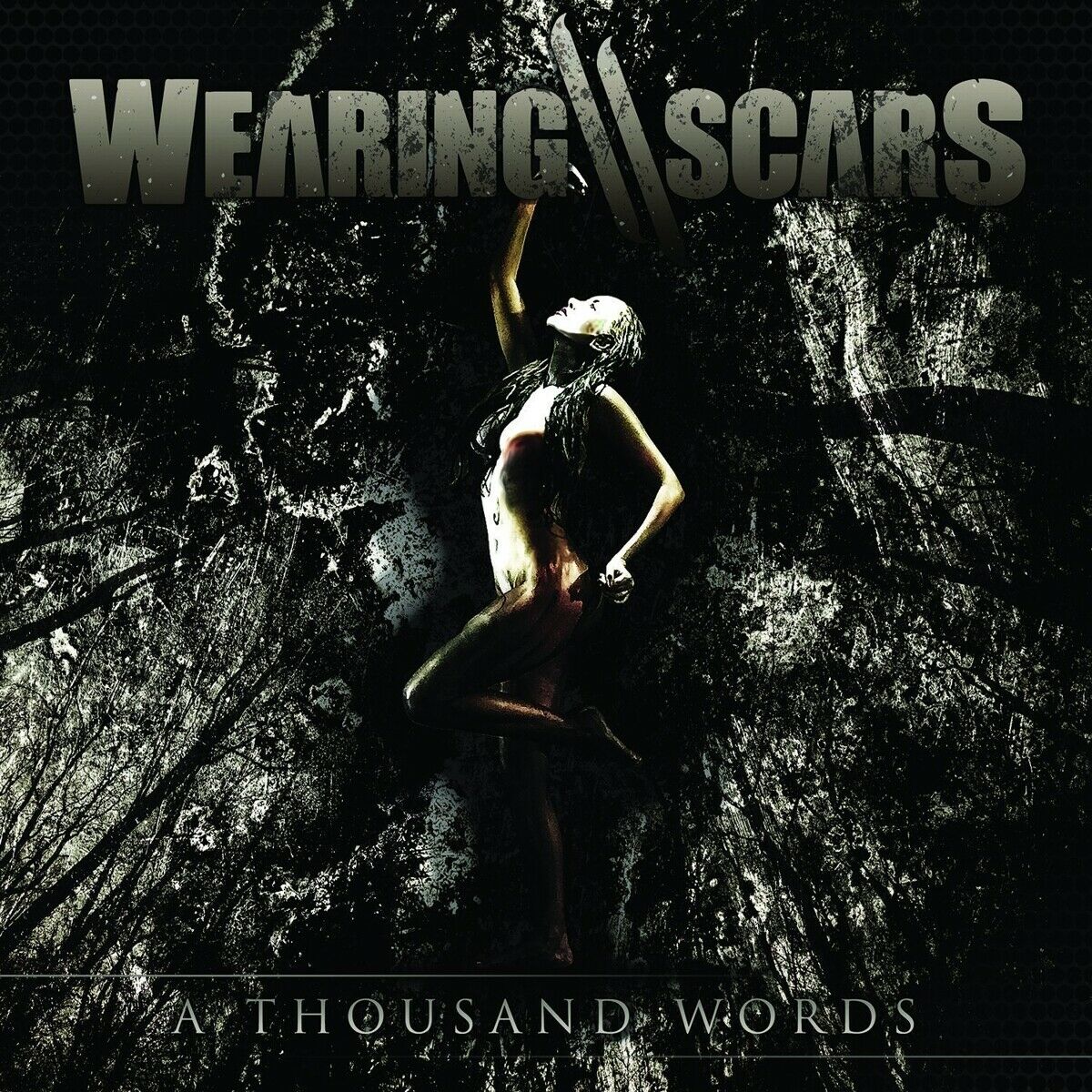 Wearing Scars - A Thousand Words i gruppen VI TIPSAR / Blowout / Blowout-CD hos Bengans Skivbutik AB (1387214)