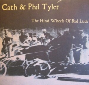 Cath & Phil Tyler - Hind Wheels Of Bad Luck i gruppen CD / World Music hos Bengans Skivbutik AB (4142668)